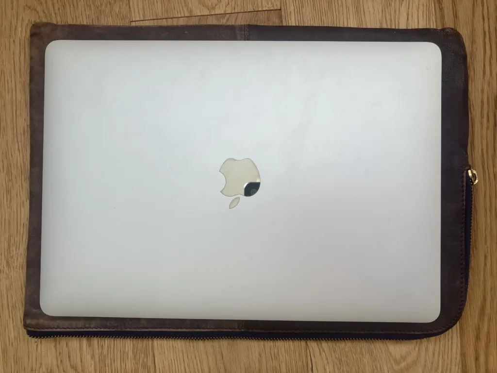 MacBook Air set on top of purple case.