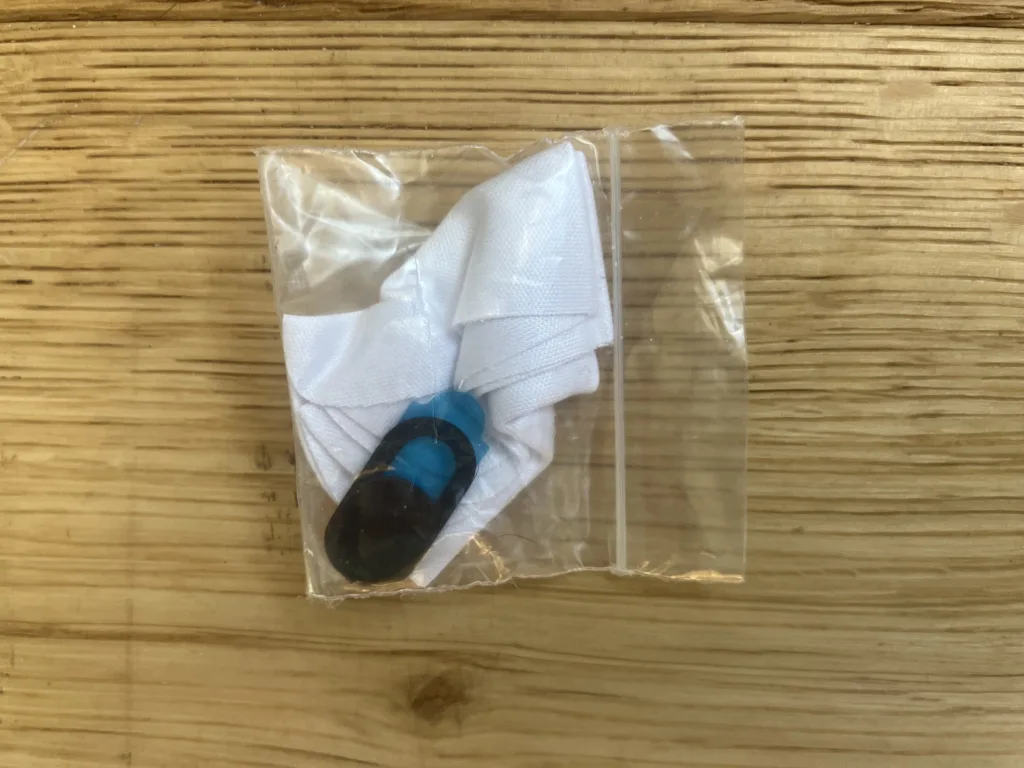 Plastic bag with cloth and webcam cover.
