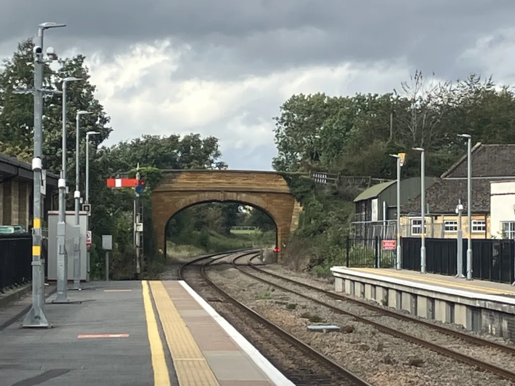 Cotswold rail station platform looking towards bridge.